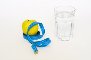 Apple, water, and tape measure