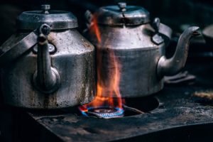 Tea pots over flame