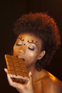 Woman eating chocolate